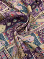 Close-up of patterned fabric with a mix of colors and designs.
