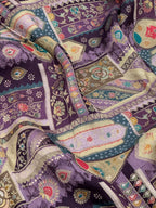 Close-up of a colorful patterned fabric with intricate designs.