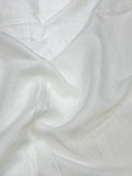 Close-up of white shantoon fabric with a soft texture