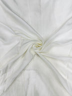 Close-up of white shantoon fabric with a subtle texture