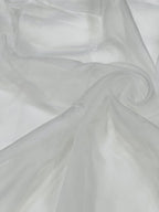 Close-up of white organza fabric with folds