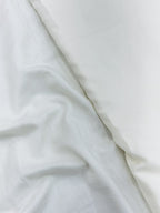 Close-up of white mul chanderi fabric with folds