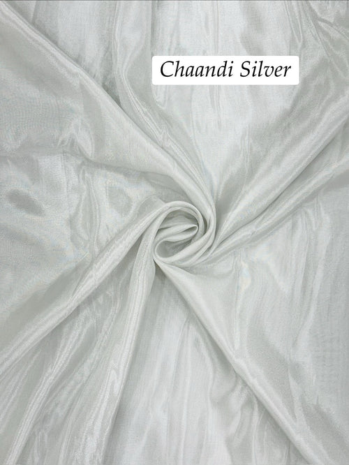 Close-up of silver shimmer tissue fabric with 'Chaandi Silver' text overlay