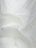 Close-up of white soft mul chanderi fabric with folds