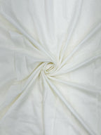 Close-up of white mul chanderi fabric with a swirl pattern