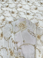 White natural crepe fabric with gold hand beads embroidery