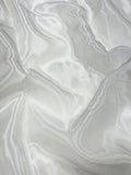 Close-up of white glass organza fabric with a soft texture