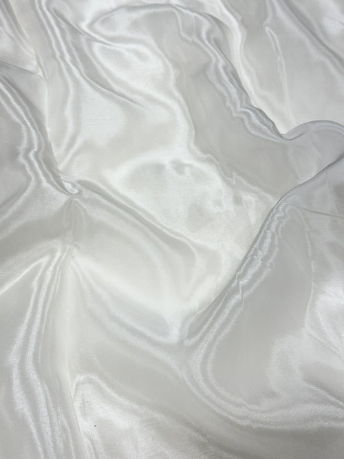 Close-up of white glass organza fabric with a soft texture
