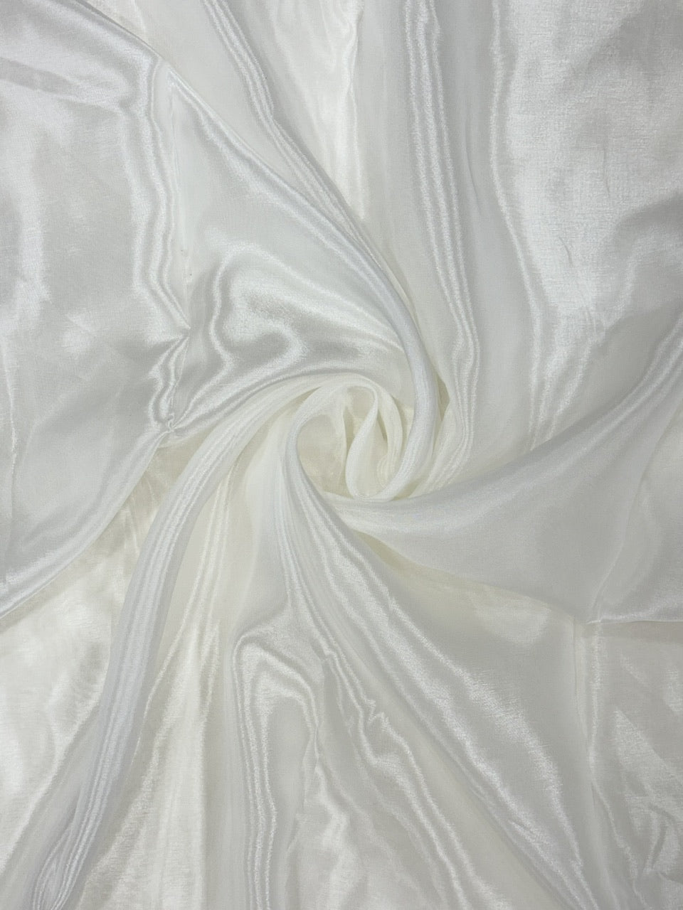 Close-up of white glass organza fabric with a glass silk like texture