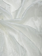 Close-up of white oppada silk fabric with a soft texture