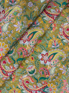 Close-up of a colorful paisley patterned fabric with intricate details.